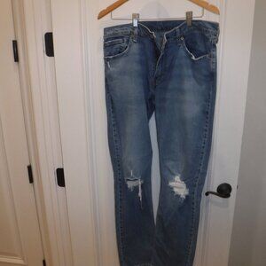 Levi Strauss 511 Blue Jeans with ripped knees. 36 x 32